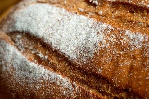 Wheat bread on a wooden table Stock Photos