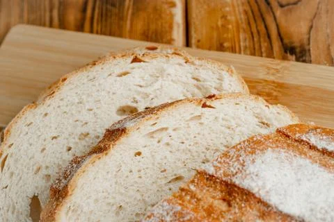 Wheat bread on a wooden table Stock Photos