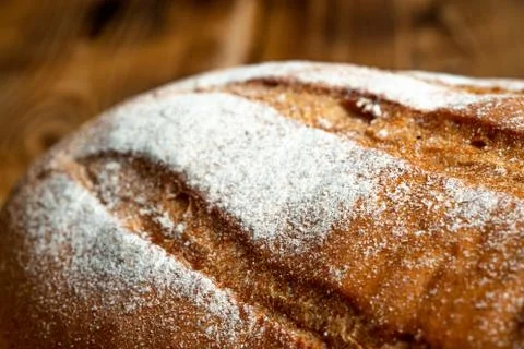 Wheat bread on a wooden table Stock Photos