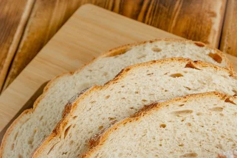 Wheat bread on a wooden table Stock Photos