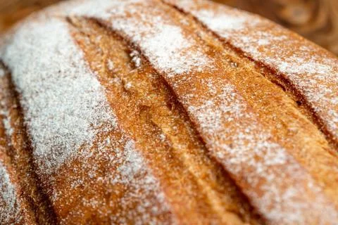 Wheat bread on a wooden table Stock Photos