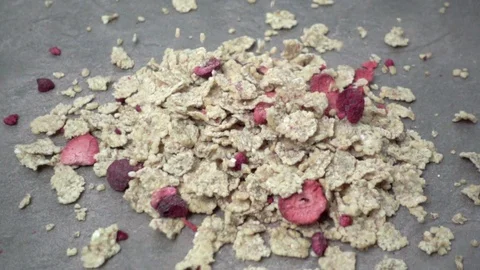 Wheat cereal flakes with dried red fruit Stock Footage 119342668