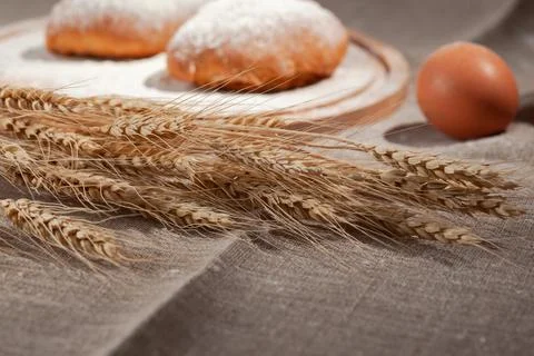 Wheat ears on a burlap Stock Photos