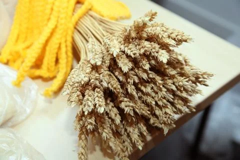 Wheat ears on rustic wooden background.Background of ripening ears of wheat f Stock Photos