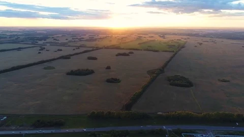 Wheat fields. Beautiful scenery from a height in sunset time. Shooting at the 库存影片 79169321