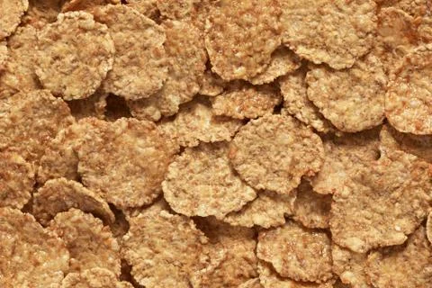 Wheat flakes background Stock Photos