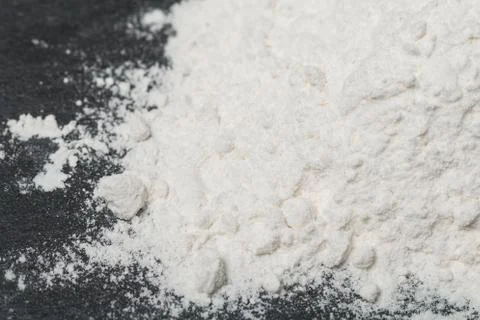 Wheat Flour on Black Background Stock Photos
