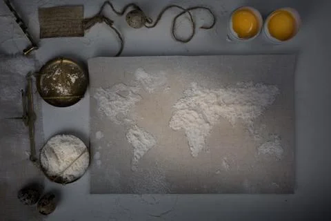 Wheat flour in the form of a world map. Food, scales vintage. top view. overhead Stock Photos