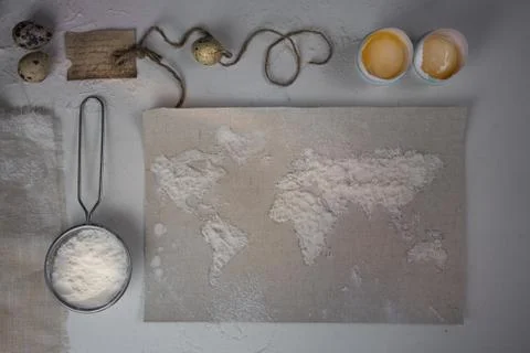 Wheat flour in the form of a world map. Food vintage. top view. overhead Stock Photos