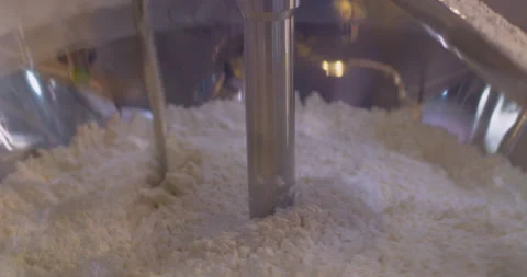 Wheat flour is mixed inside an industrial mixer. Close-up Vídeos de archivo 317340969