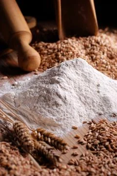 Wheat flour on the table with kitchen utensils Stock Photos