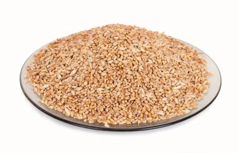 Wheat grains on plate Stock Photos