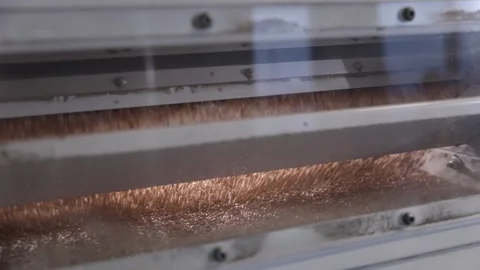 Wheat grains pour down onto platform after sorting operation in modern mill Video stock 318925514