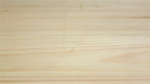 Wheat grains in slow motion falling on wooden table. Closeup Vidéo 75489818