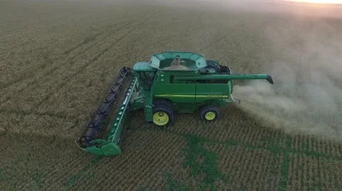 Wheat Harvest Combine Side View - Drone Stock Footage 65029946