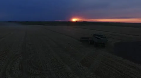 Wheat Harvest John Deere Combine Sunset - Drone Stock Footage 65028657