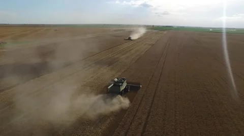 Wheat Harvest John Deere Combines Cutting at Same Time - Drone Stock Footage 65028697