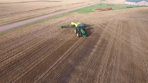 Wheat Harvest John Deere Tractor - Drone Stock Footage 65028792