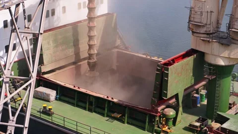 Wheat loading to bulker ship cargo container at sea grain terminal in seaport Stock Footage 246672958