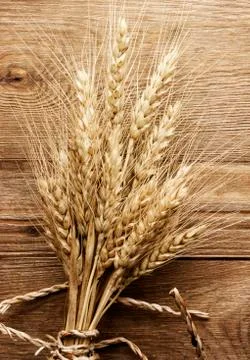 Wheat on the wood background Stock Photos