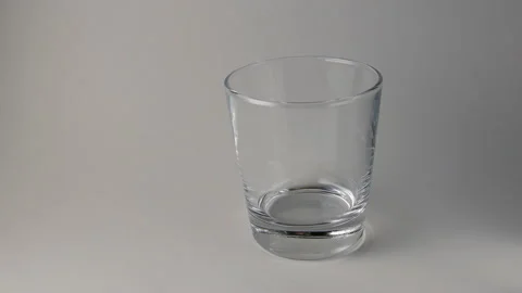 Wheatgrass cubes fall into the glass Stock Footage 155355996