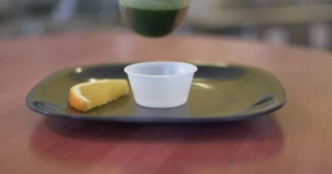 Wheatgrass Pour In a Juice Bar Stock Footage 61193757