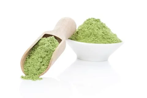 Wheatgrass powder. Stock Photos
