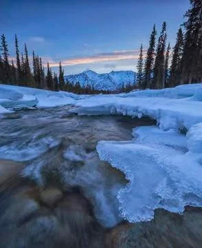 The Wheaton River at sunrise as it flows towards Grey Ridge, near Whitehorse, Stock Photos