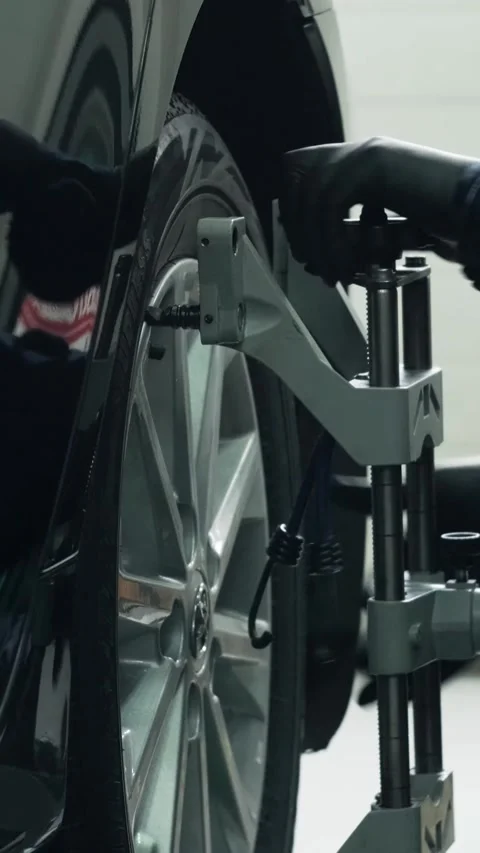 Wheel alignment procedure on modern laser stand in car service Stock Footage 332858463