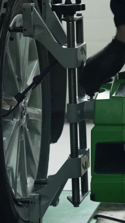 Wheel alignment procedure on modern laser stand in car service Stock Footage 332858465