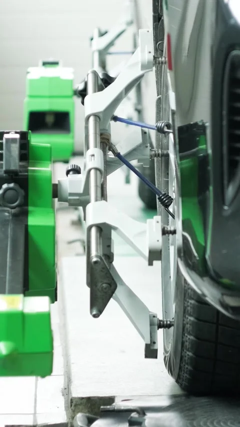 Wheel alignment procedure on modern laser stand in car service Stock Footage 332858466