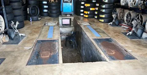 Wheel Alignment Workshop Pit and Tire Storage in Terengganu, Malaysia 写真素材