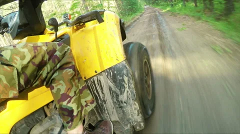 Wheel ATV drives into a deep mud puddle Stock Footage 57707649