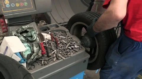 Wheel balancing by Mechanic Video stock 50223736