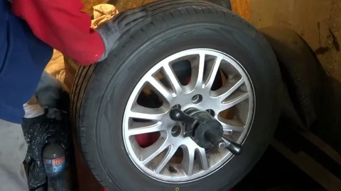 Wheel balancing on the tire changer Stock Footage 94915034