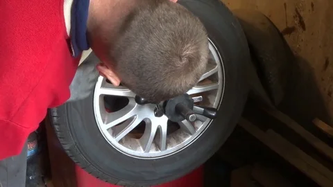 Wheel balancing on the tire changer Stock Footage 104561890
