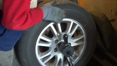 Wheel balancing on the tire changer Stock Footage 104562264