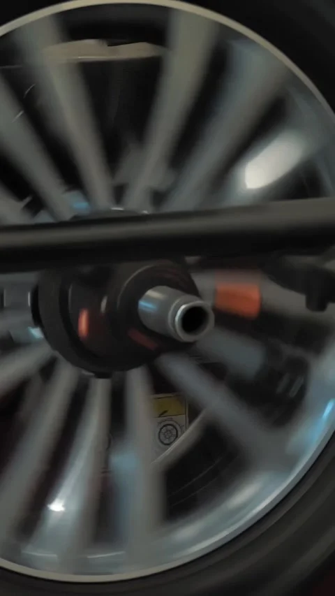 Wheel balancing. Tire fitting. Car service. close-up. The wheel is spinning for Video stock 316137637