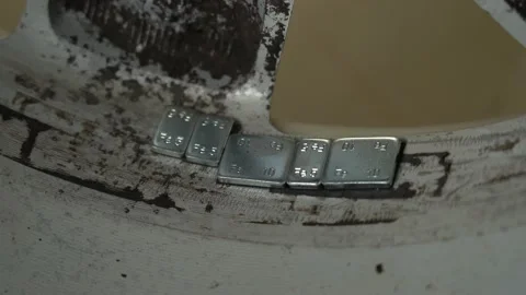 Wheel balancing weights clips attached to disks with tires for proper balance Video stock 152130856