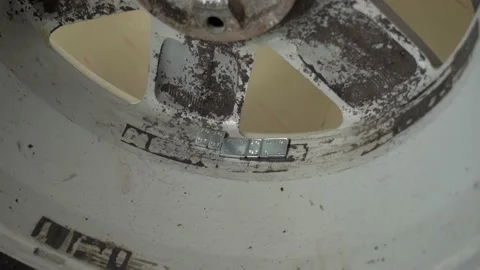 Wheel balancing weights clips attached to wheel disks with tires Video stock 152135110