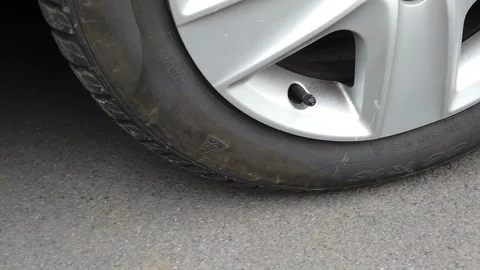 Wheel of a car moving slow motion close up Stock Footage 124092742