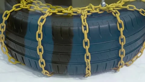 Wheel chains for winter anti-skid protection are on display at the exhibition Stock Footage 340460844