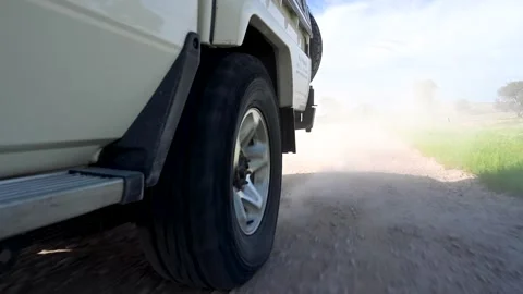 Wheel on a Dirt Road Stock Footage 132830014