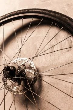 Wheel  on the gray wall background Stock Photos