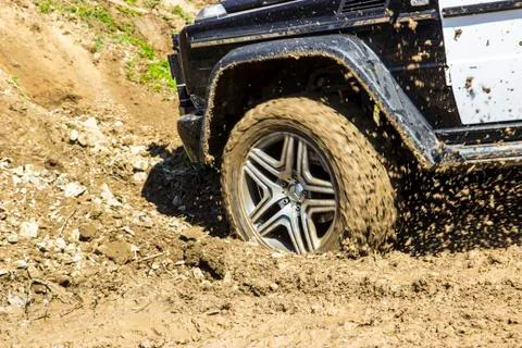 Wheel of a jeep in the mud Stock Photos