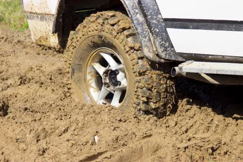 Wheel of a jeep in the mud Stock Photos
