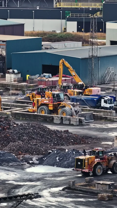 Wheel Loader and Excavator Working in Scrap Metal Yard at Steelworks Stock Footage 345433008