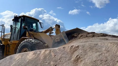 Wheel loader with a bucket in front, Close shot Stock Footage 249624552