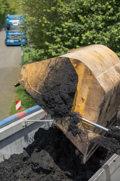 Wheel loader bucket - semi trailer Stock Photos