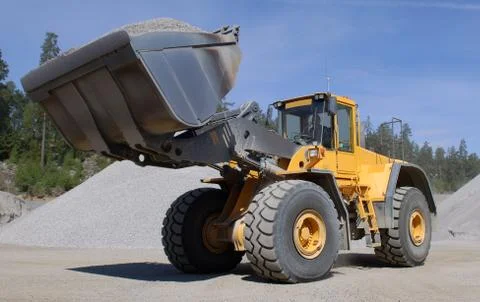 Wheel loader construction machine at work Stock Photos